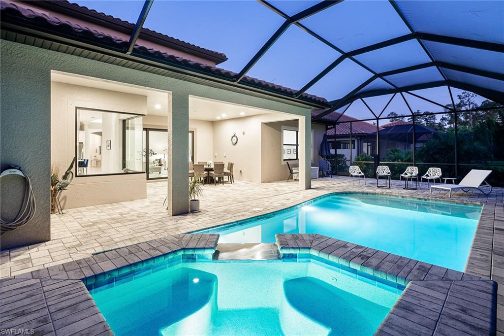 1423 Mockingbird Drive Naples, FL 34120 - Photo 4 of 32 a swimming pool with outdoor seating and yard