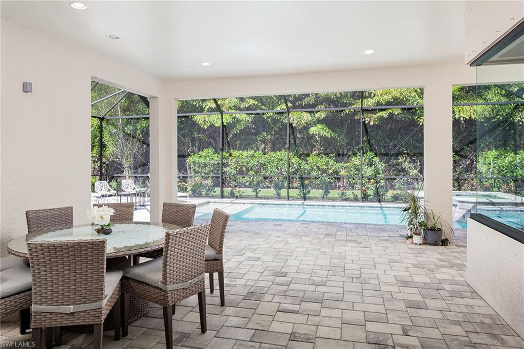 1423 Mockingbird Drive Naples, FL 34120 - Photo 7 of 32 a outdoor living space with furniture and garden view