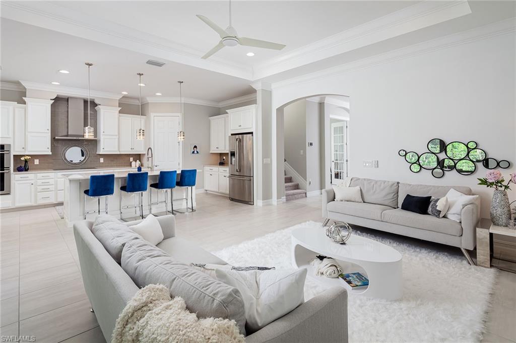 1423 Mockingbird Drive Naples, FL 34120 - Photo 8 of 32 a living room with furniture and a view of kitchen