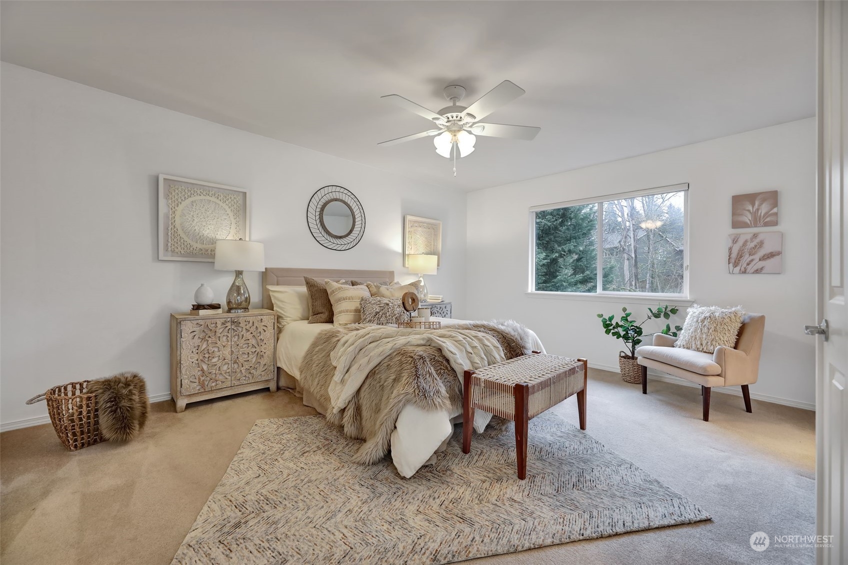 3714 Lincoln Court Northeast Renton, WA 98056 - Photo 16 of 33 a spacious bedroom with a bed and a chandelier