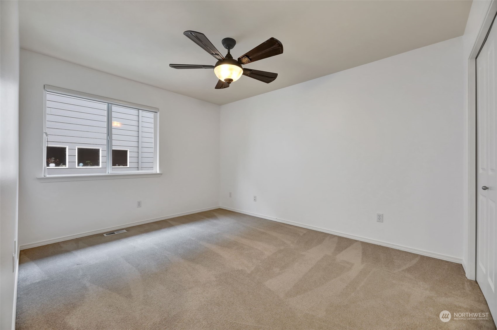 3714 Lincoln Court Northeast Renton, WA 98056 - Photo 23 of 33 an empty room with windows and fan