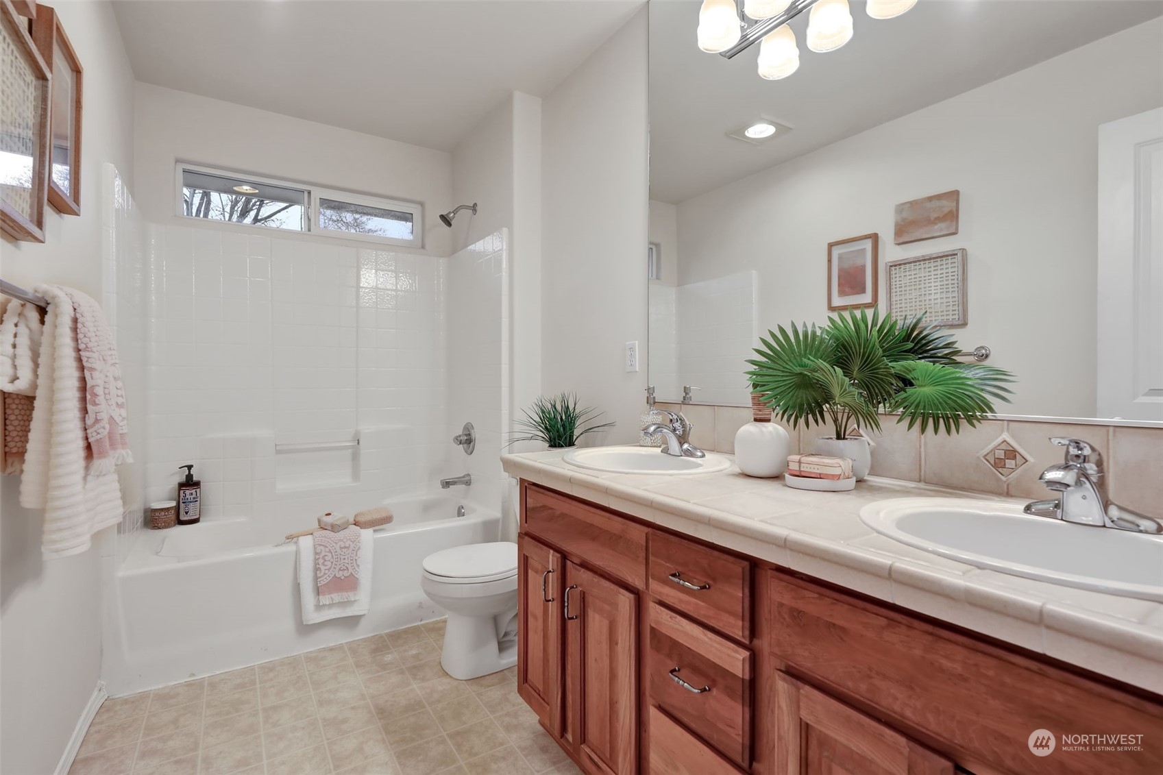 3714 Lincoln Court Northeast Renton, WA 98056 - Photo 24 of 33 a bathroom with a double vanity sink toilet and shower