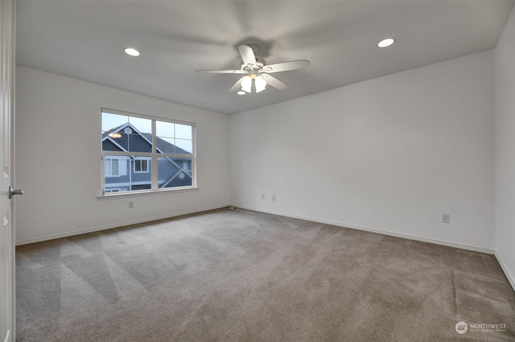 3714 Lincoln Court Northeast Renton, WA 98056 - Photo 29 of 33 an empty room with windows and ceiling fan