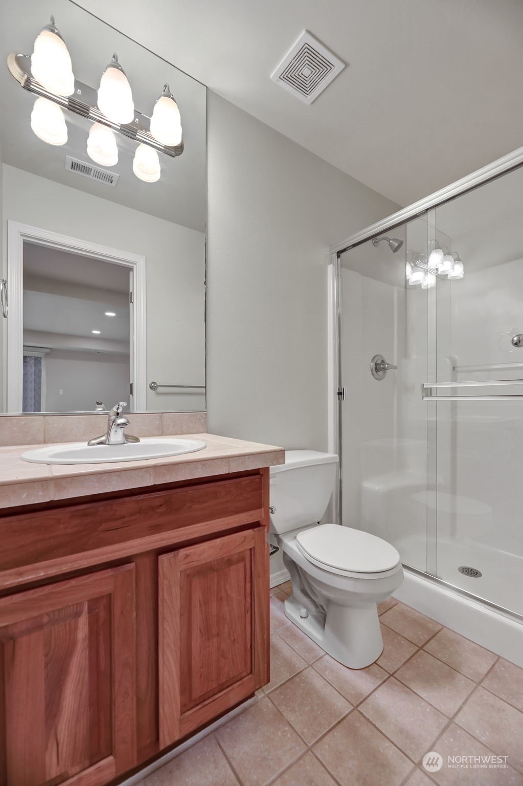 3714 Lincoln Court Northeast Renton, WA 98056 - Photo 30 of 33 a bathroom with a sink a toilet a mirror and shower