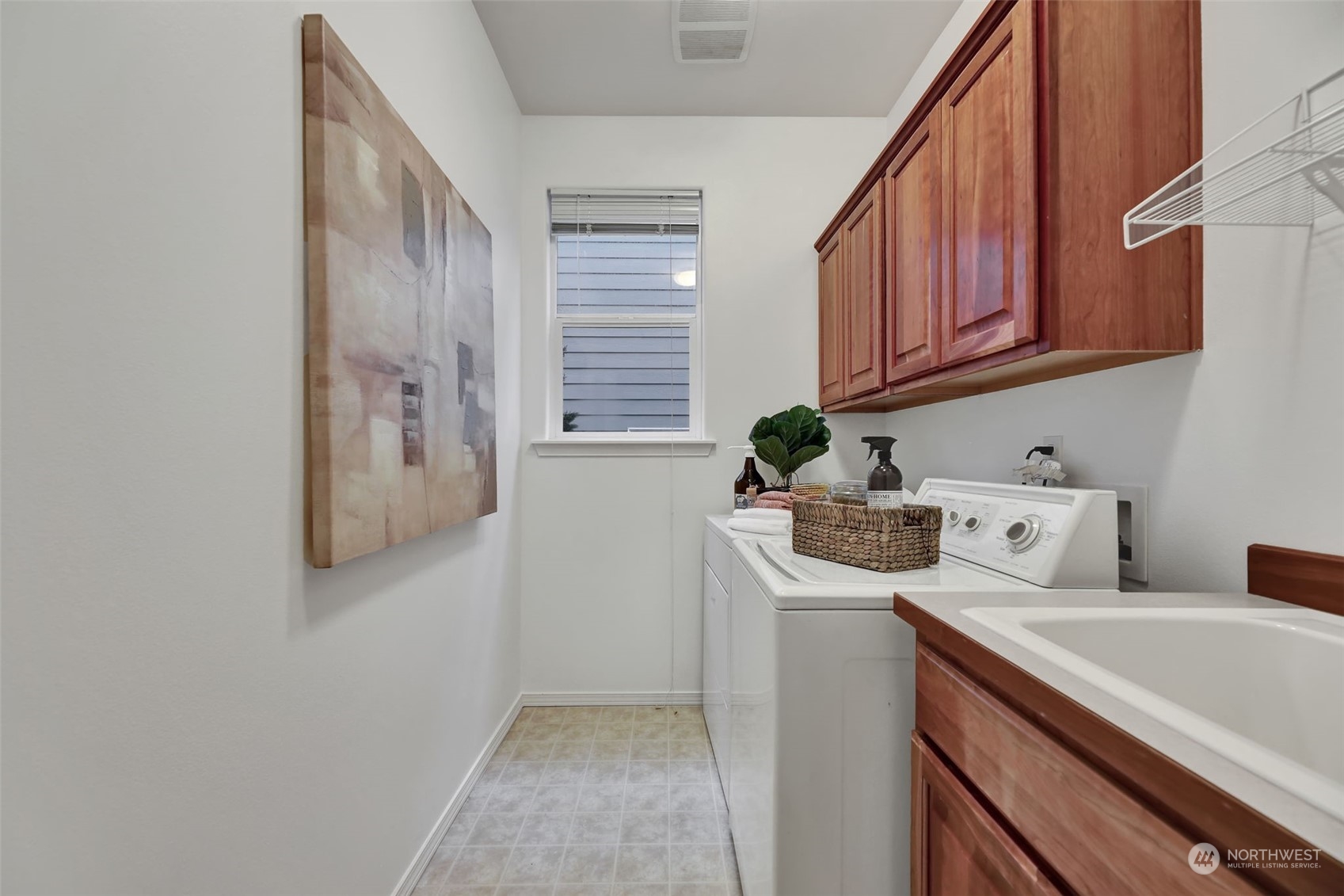 3714 Lincoln Court Northeast Renton, WA 98056 - Photo 32 of 33 a view of a storage and utility room with washer and dryer