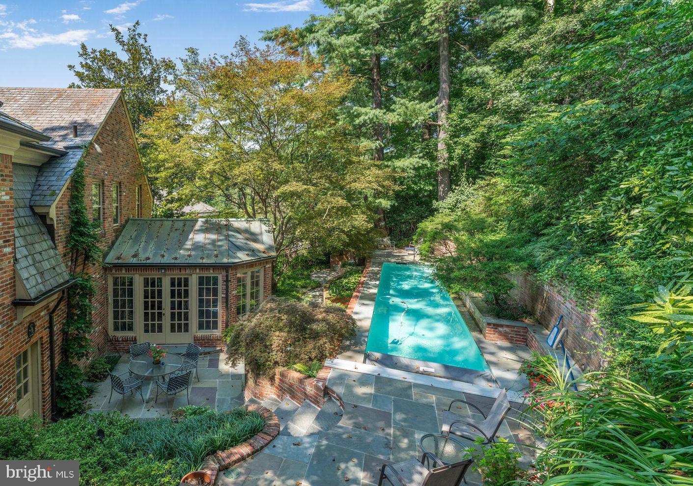 View of pool and sunroom