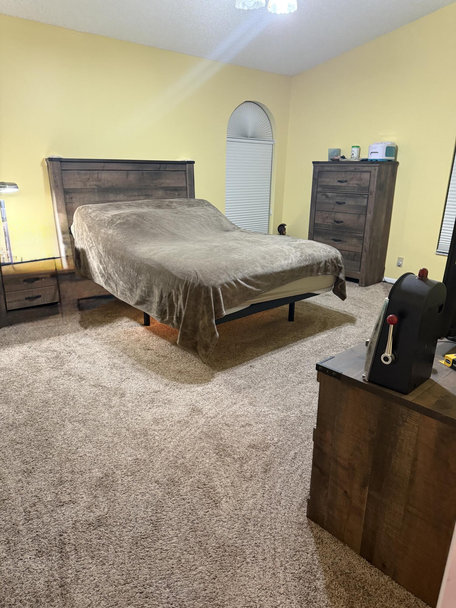 7024 Golf Pointe Circle Tamarac, FL 33321 - Photo 12 of 28 a bedroom with bed and window