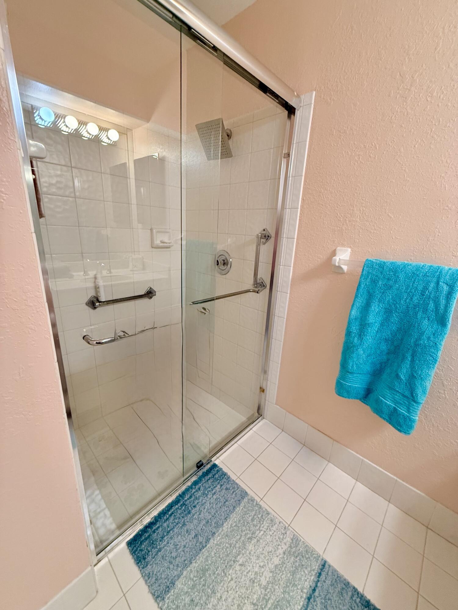7024 Golf Pointe Circle Tamarac, FL 33321 - Photo 22 of 28 a bathroom with a shower