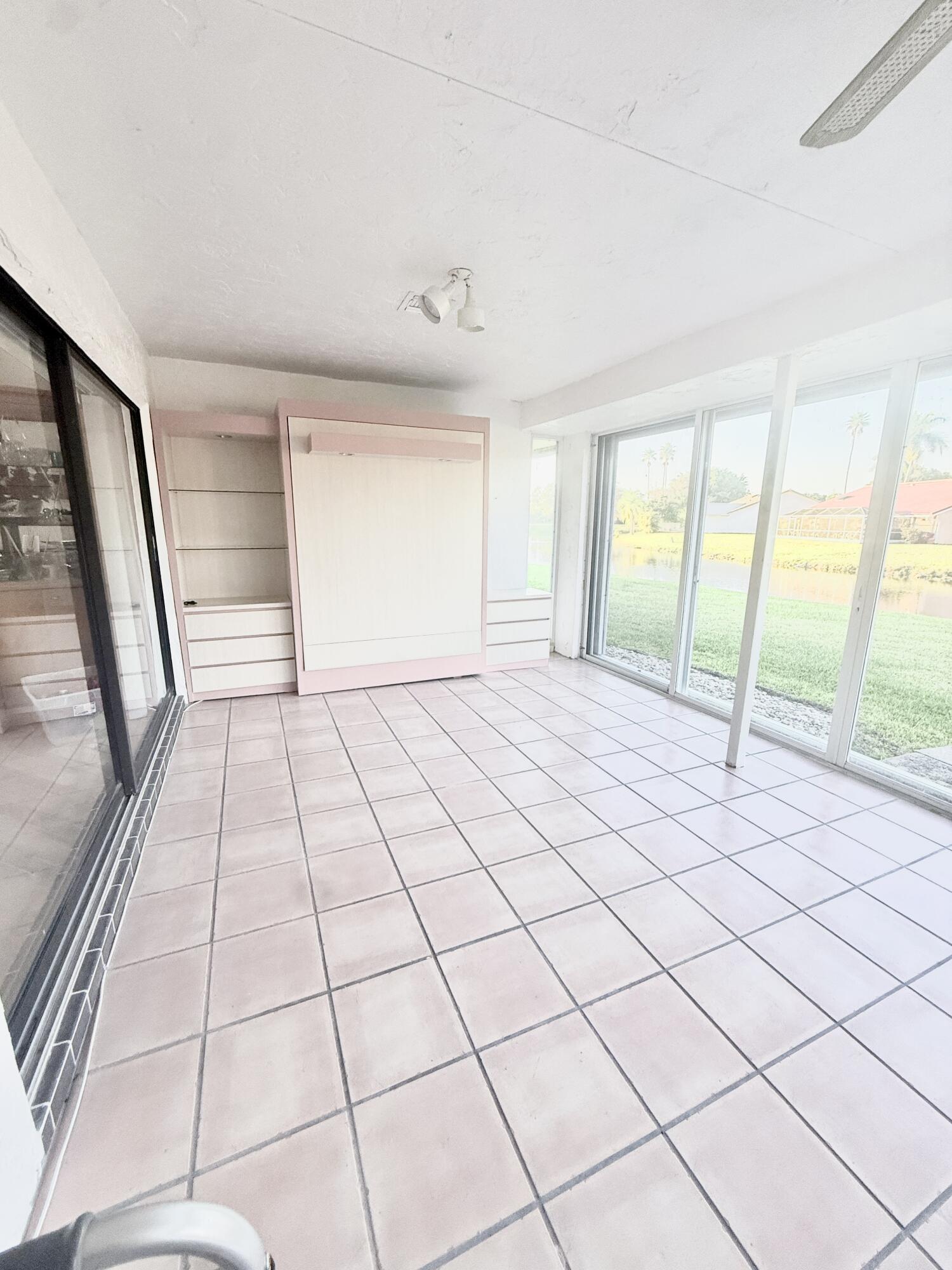 7024 Golf Pointe Circle Tamarac, FL 33321 - Photo 25 of 28 a view of an empty room and a window