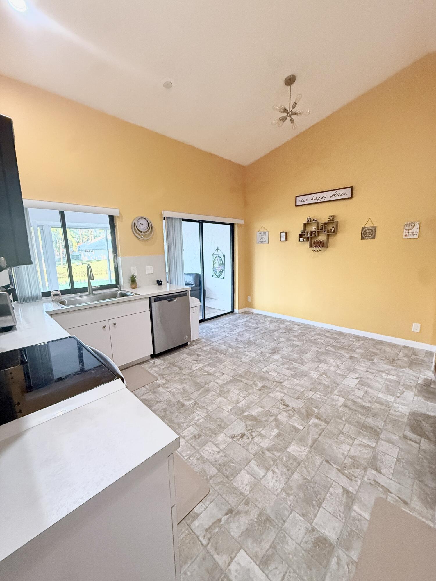 7024 Golf Pointe Circle Tamarac, FL 33321 - Photo 7 of 28 a bedroom with a bed and a dresser