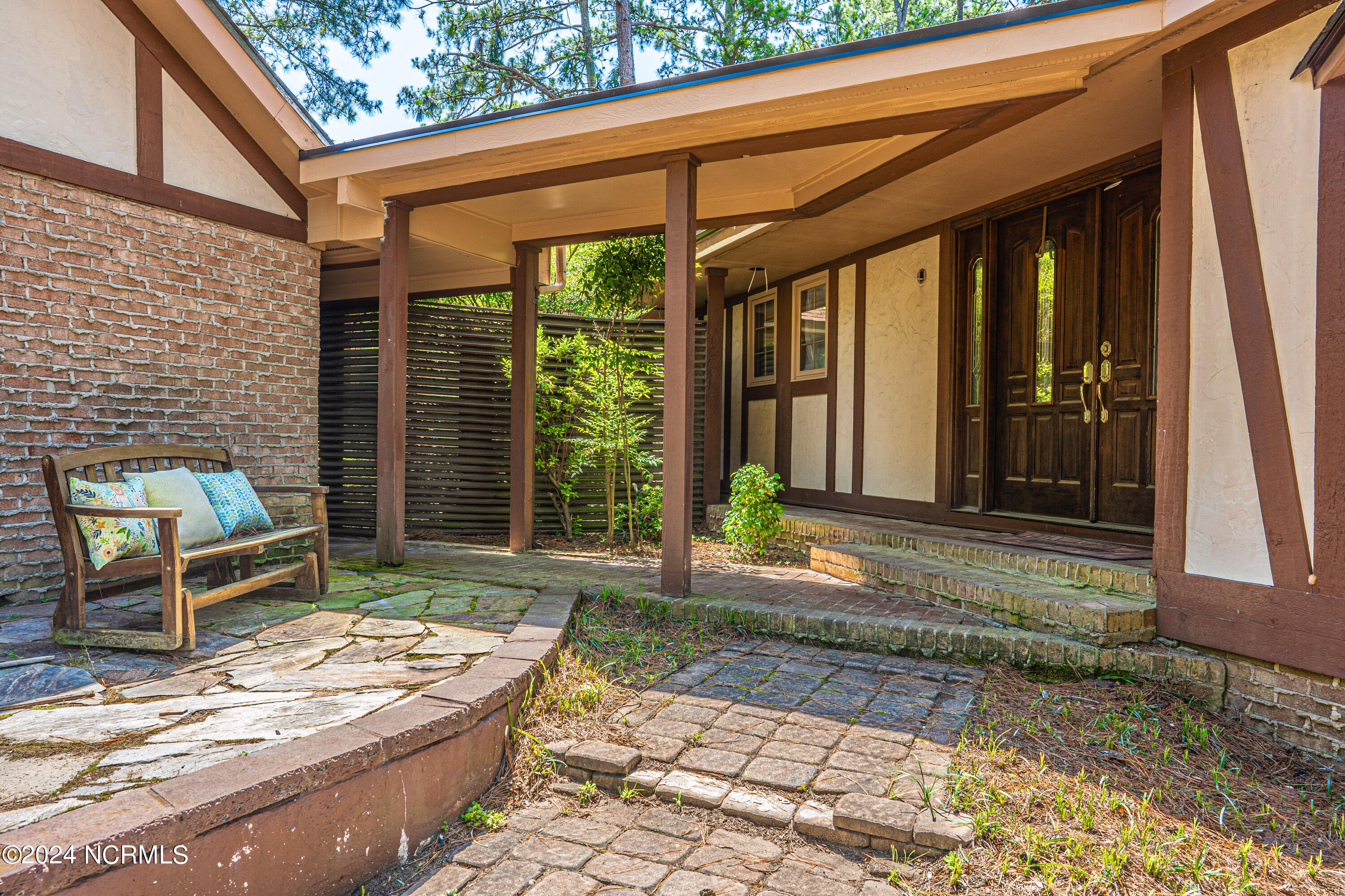3 Thunderbird Circle Pinehurst, NC 28374 - Photo 6 of 25 Breezeway from garage leads to front porch and stone patio