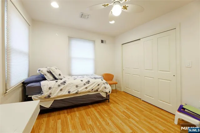 a bedroom with bed and window