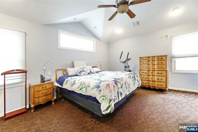 a bed room with a bed and a window