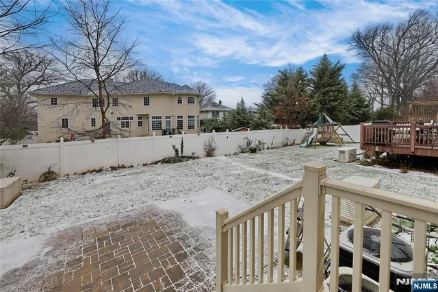 a view of a dry yard covered with snow on the road
