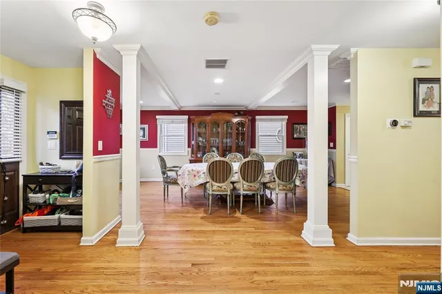 a view of a dining room with furniture and a floor to ceiling window