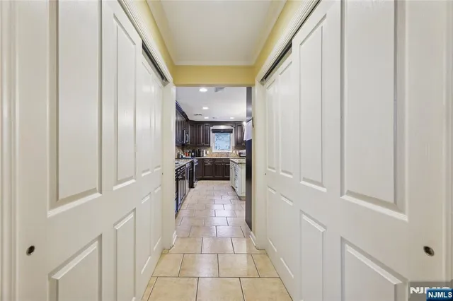a view of a hallway with a kitchen view