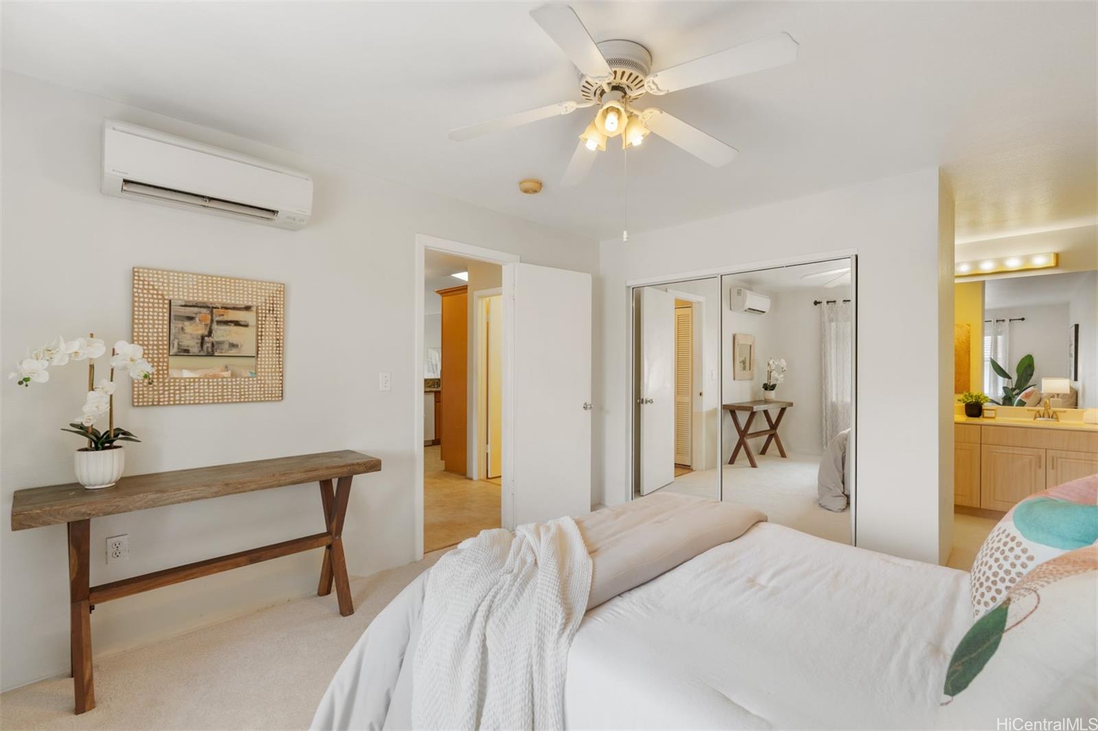 92-1487-a Aliinui Drive, Unit 27A Kapolei, HI 96707 - Photo 15 of 24 a bedroom with a bed and a chandelier