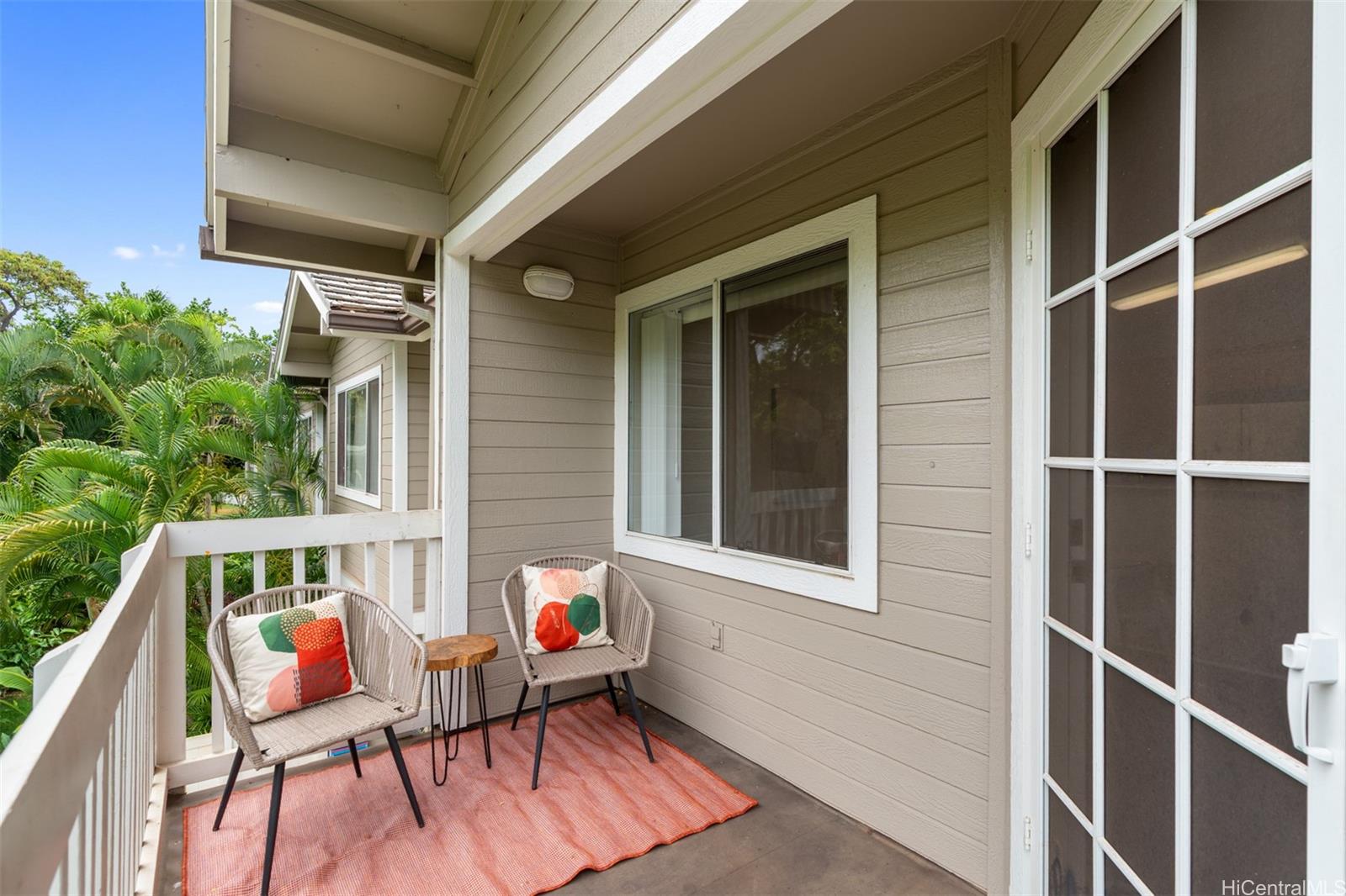 92-1487-a Aliinui Drive, Unit 27A Kapolei, HI 96707 - Photo 16 of 24 a balcony with furniture and a potted plant