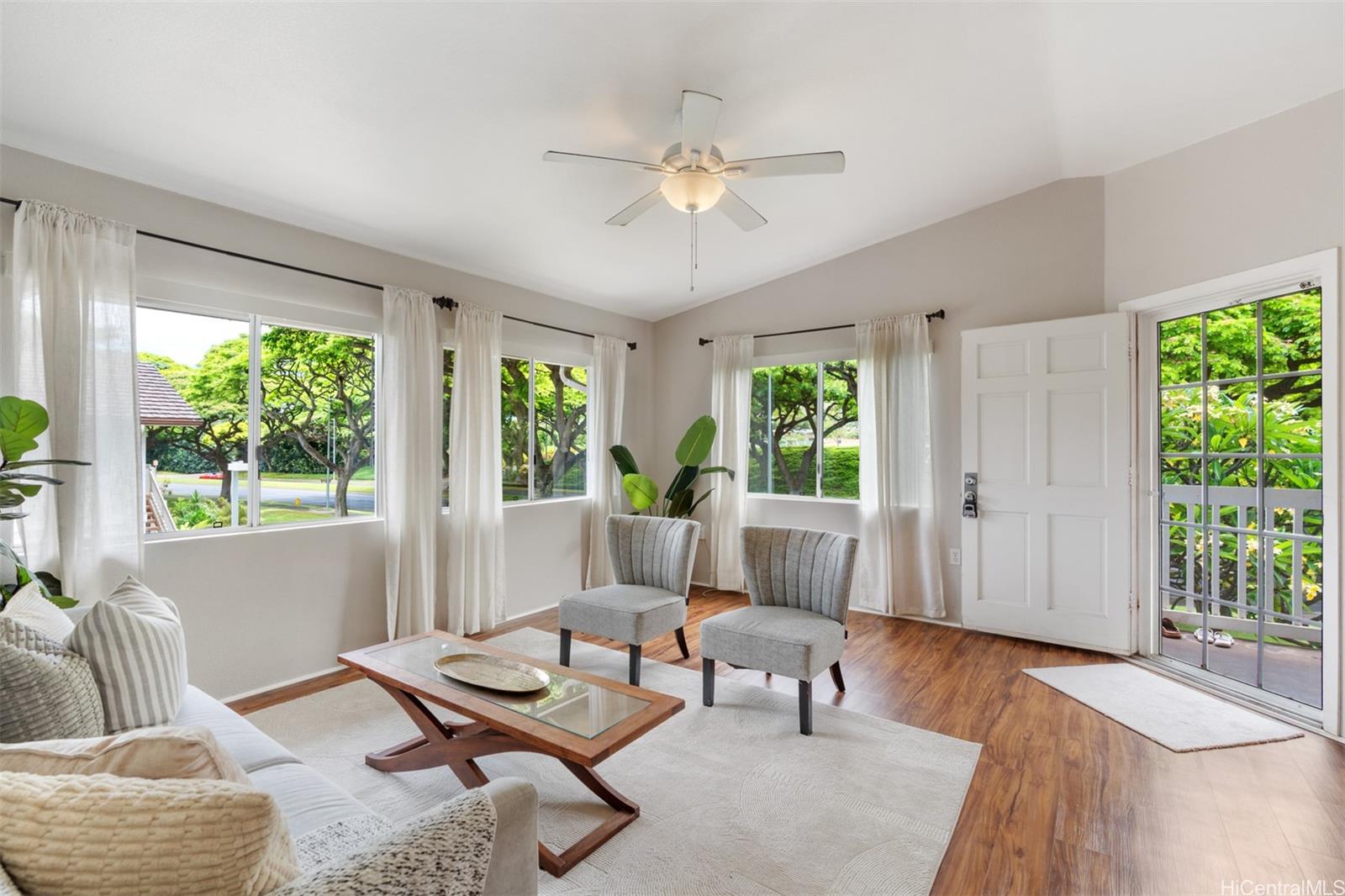 92-1487-a Aliinui Drive, Unit 27A Kapolei, HI 96707 - Photo 2 of 24 a living room with furniture and a large window