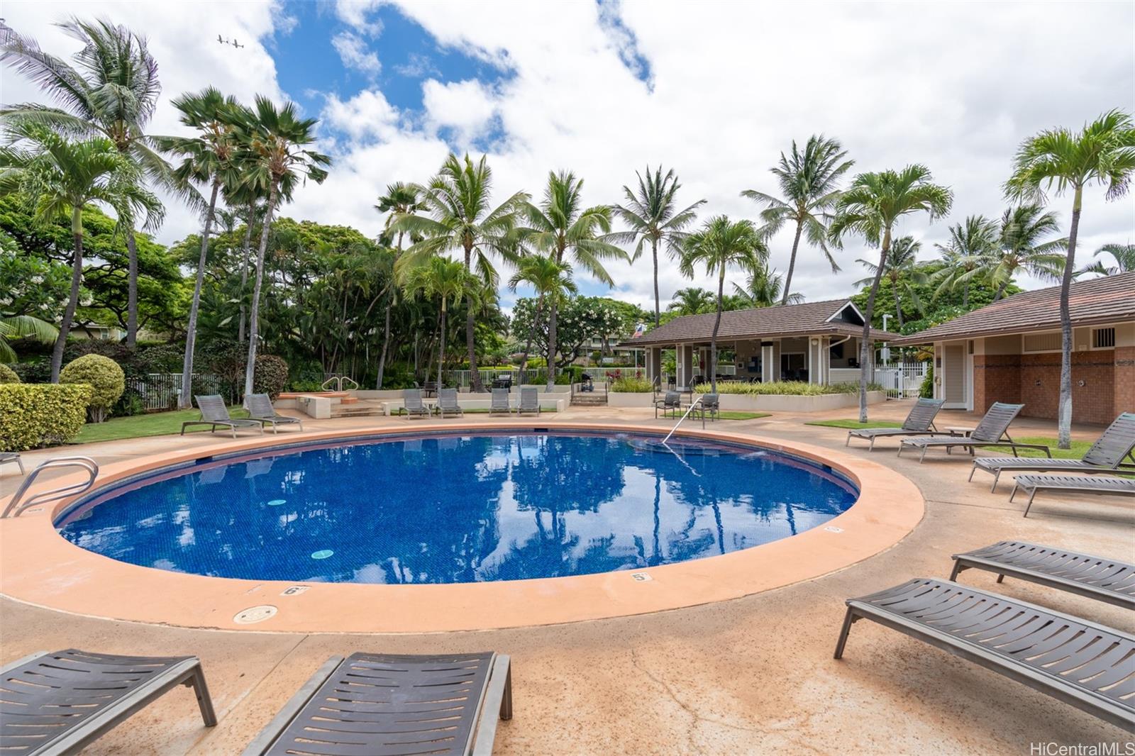 92-1487-a Aliinui Drive, Unit 27A Kapolei, HI 96707 - Photo 23 of 24 a swimming pool with outdoor seating and yard