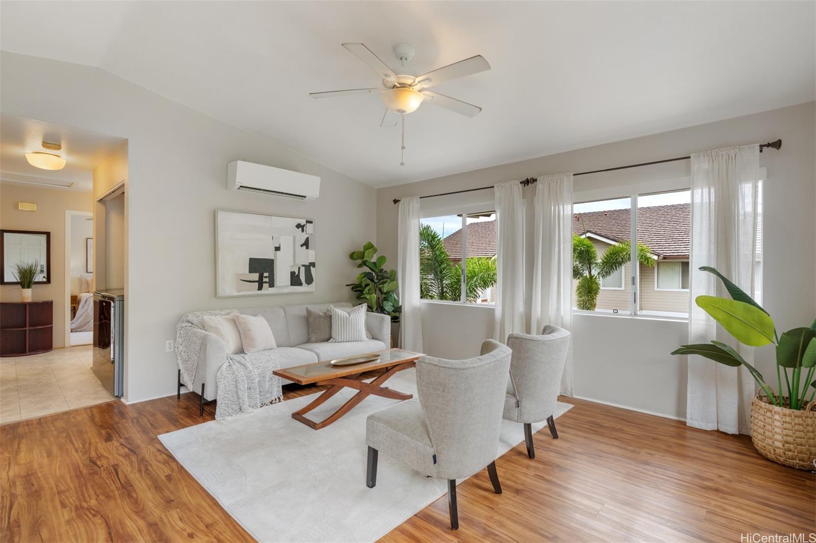 92-1487-a Aliinui Drive, Unit 27A Kapolei, HI 96707 - Photo 3 of 24 a living room with furniture and a potted plant