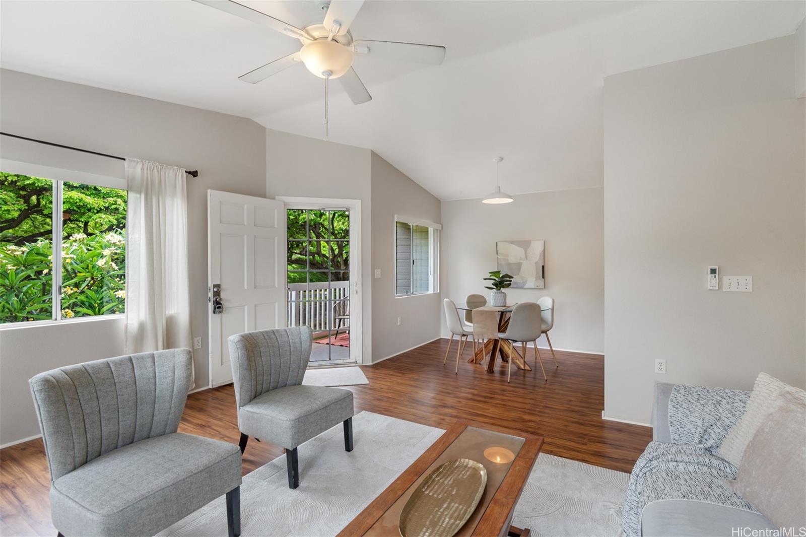 92-1487-a Aliinui Drive, Unit 27A Kapolei, HI 96707 - Photo 4 of 24 a living room with furniture and a large window