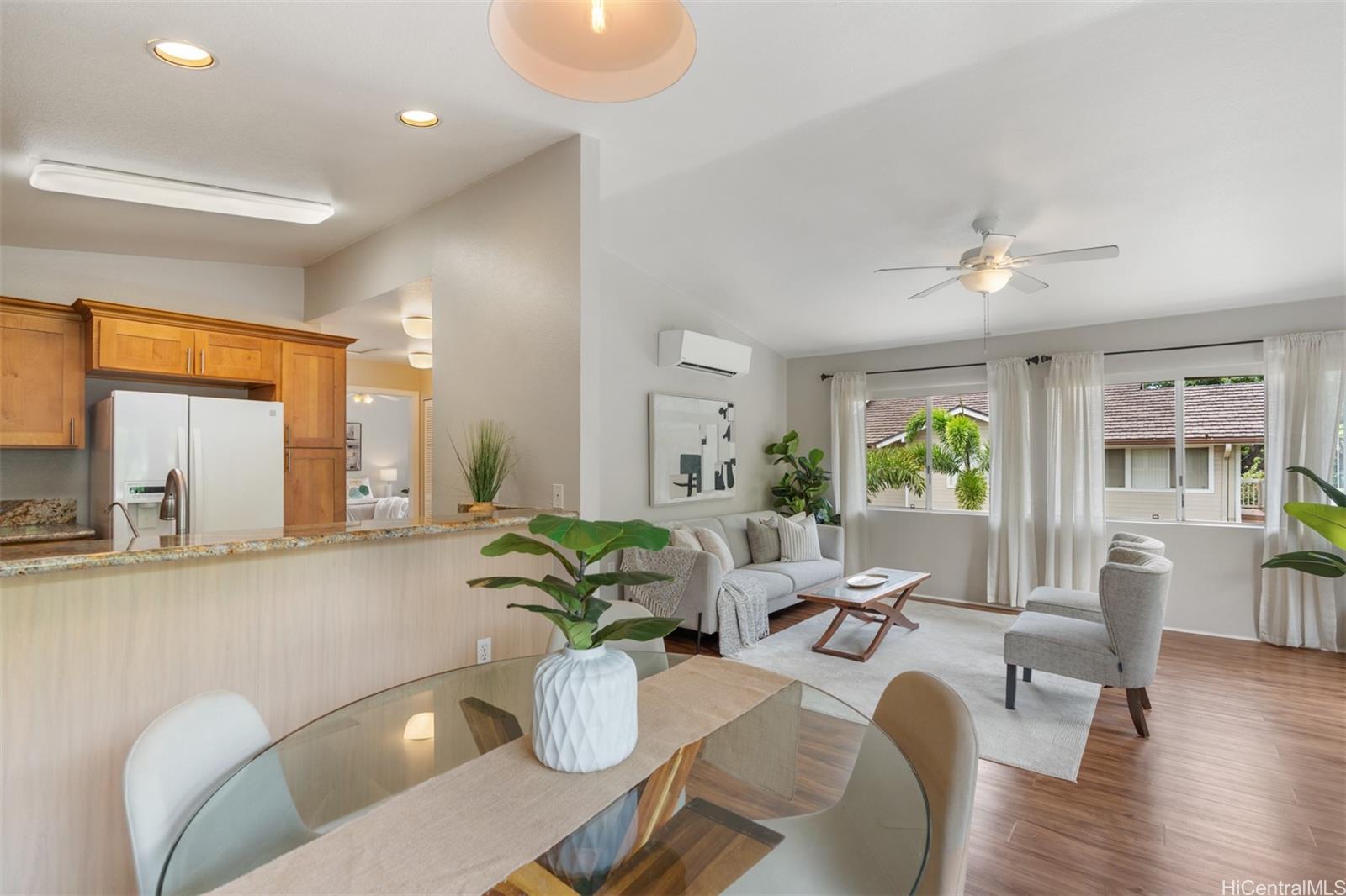 92-1487-a Aliinui Drive, Unit 27A Kapolei, HI 96707 - Photo 5 of 24 a living room with furniture a window and wooden floor