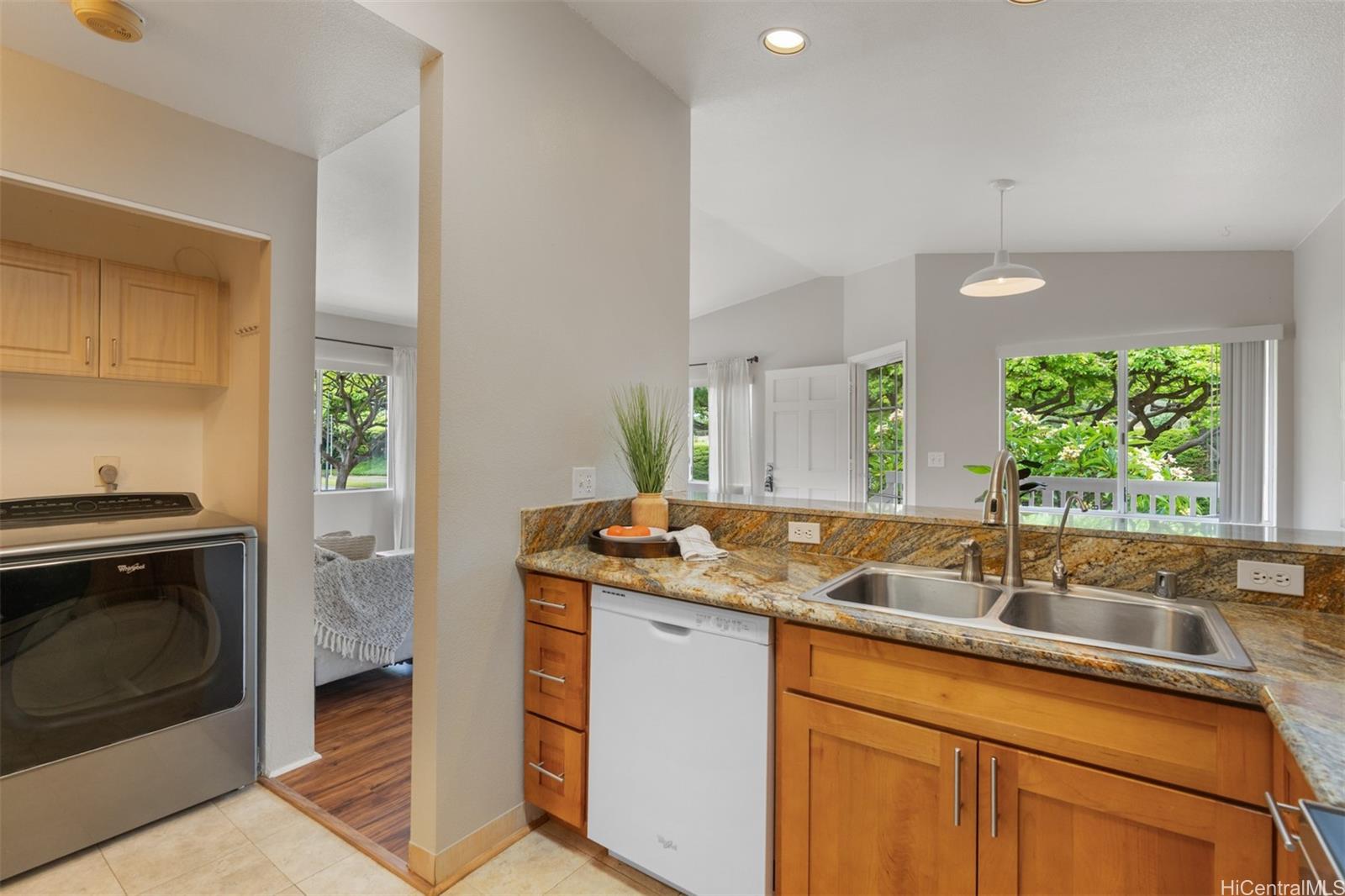 92-1487-a Aliinui Drive, Unit 27A Kapolei, HI 96707 - Photo 8 of 24 a kitchen with a sink stove and cabinets