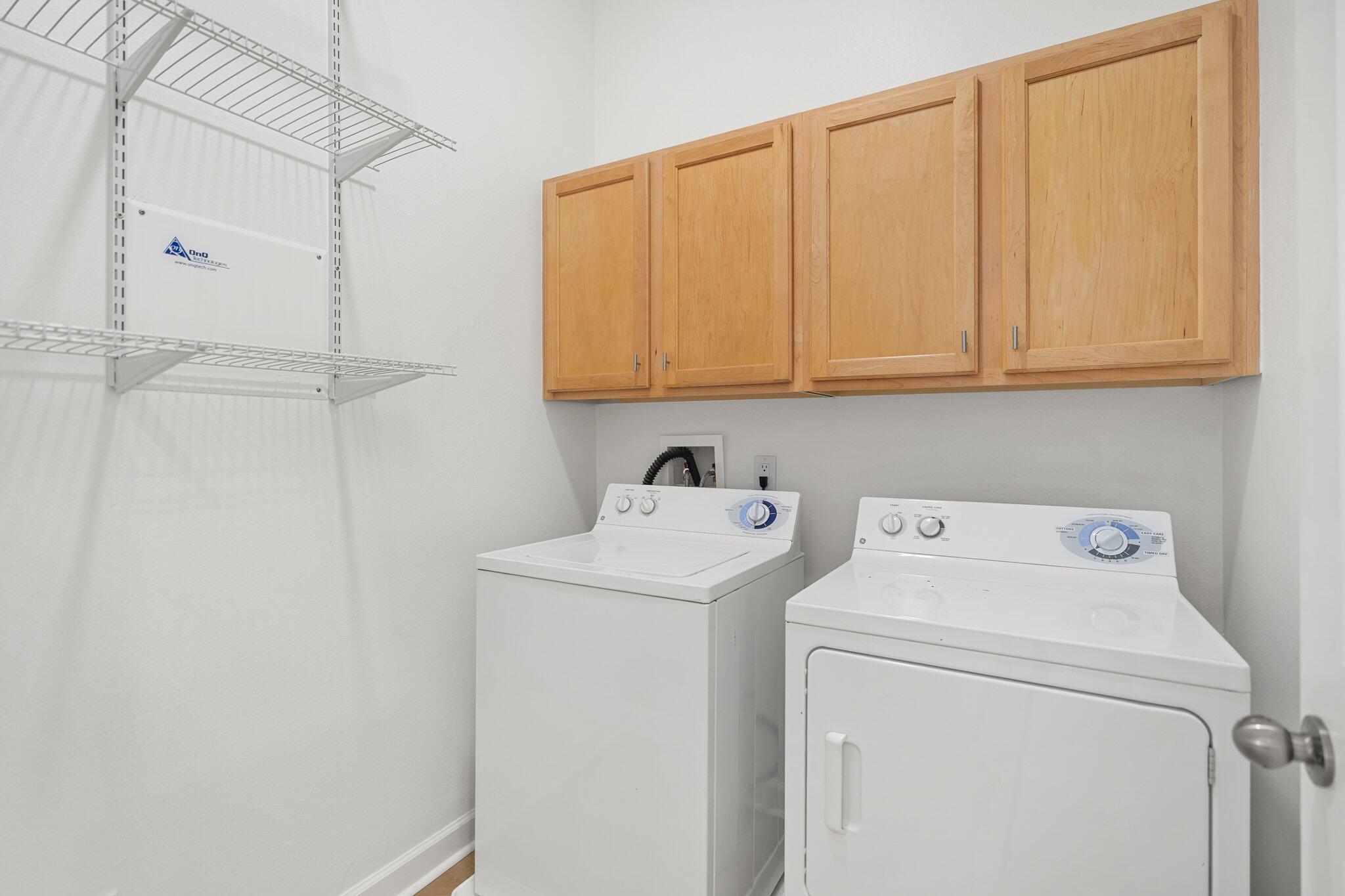 2221 Crystal Cove Lane, Unit 2221 Miramar Beach, FL 32550 - Photo 13 of 32 a utility room with dryer and washer
