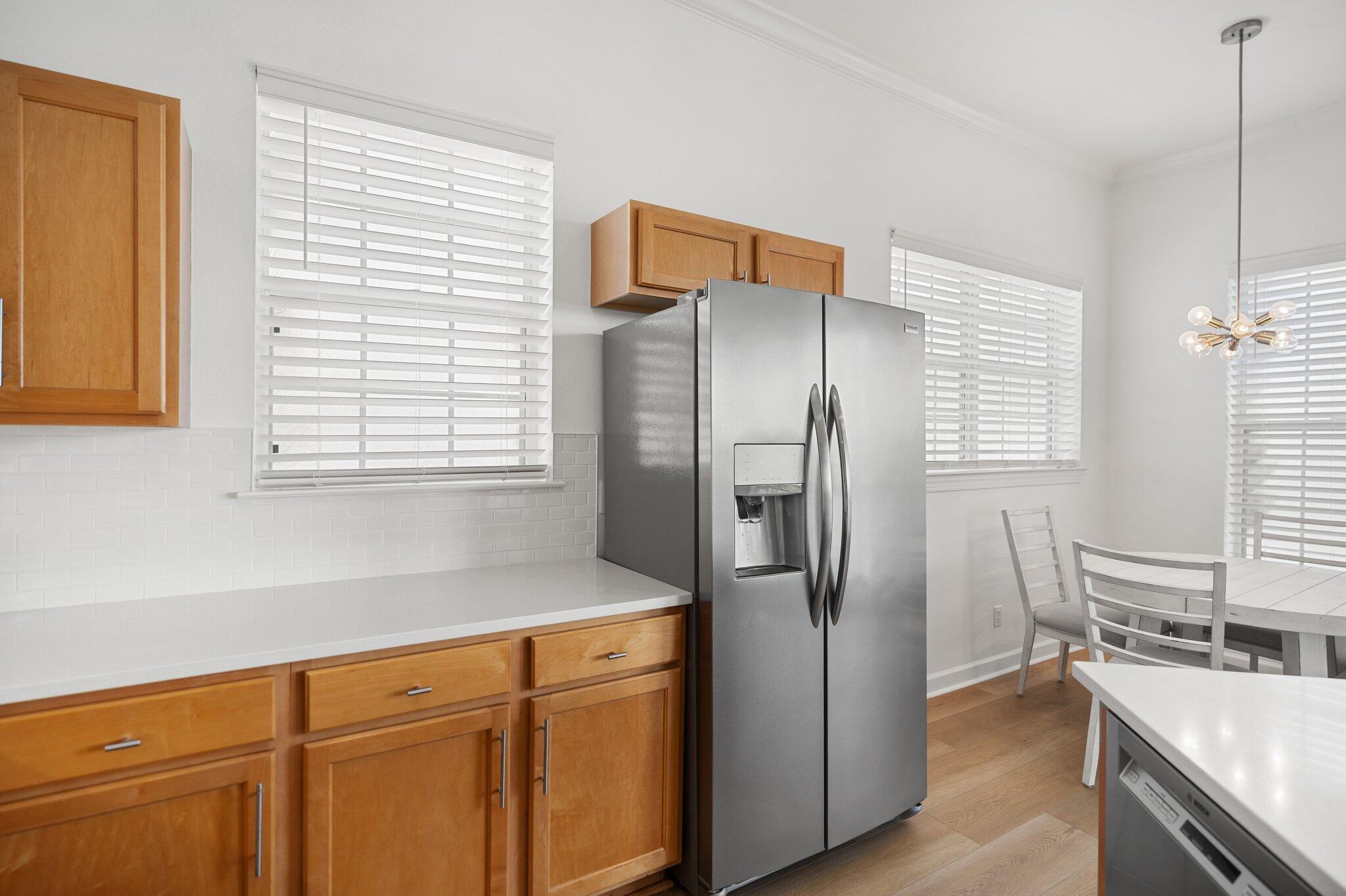 2221 Crystal Cove Lane, Unit 2221 Miramar Beach, FL 32550 - Photo 20 of 32 a kitchen with stainless steel appliances a refrigerator sink and cabinets