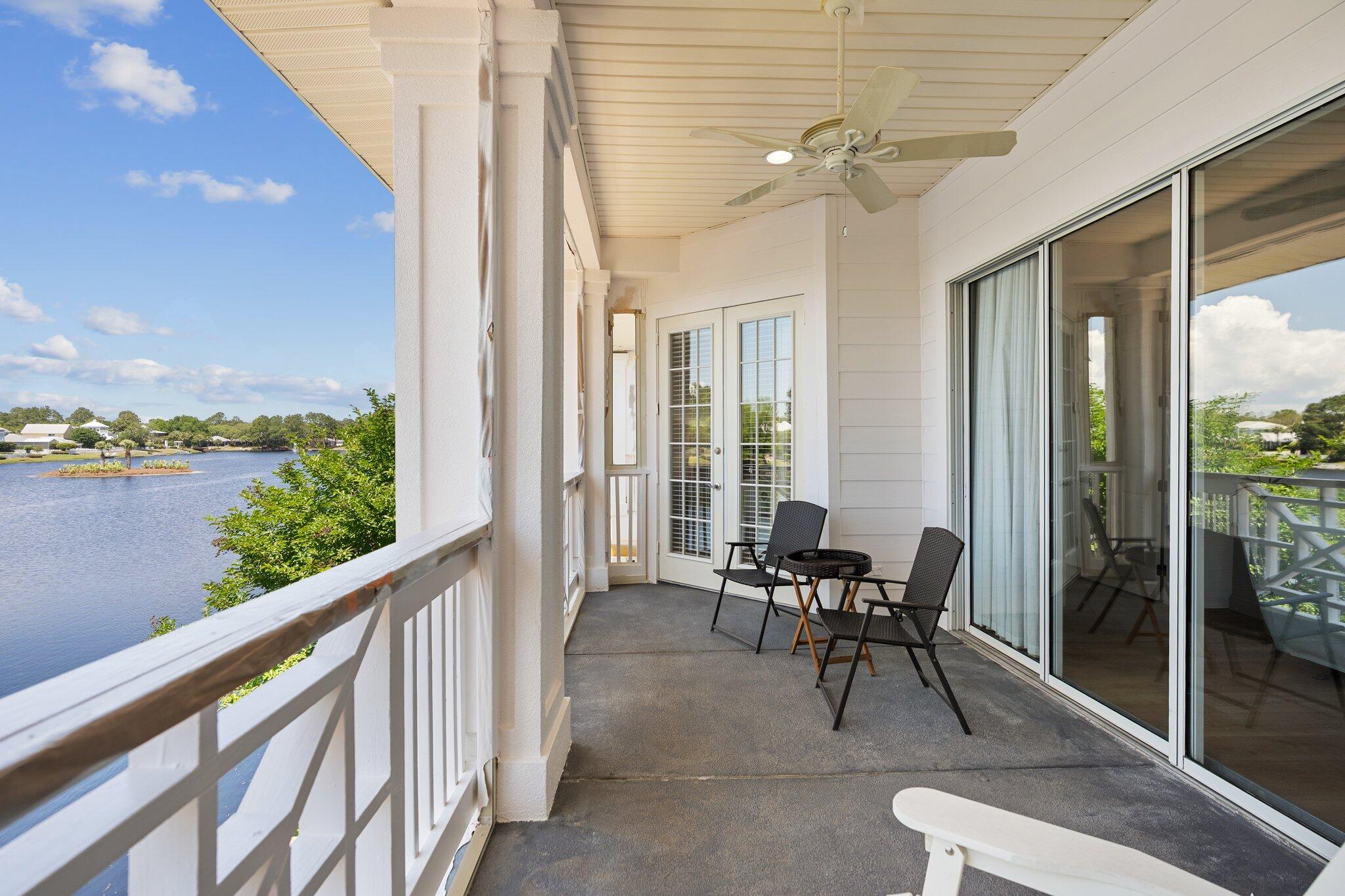 2221 Crystal Cove Lane, Unit 2221 Miramar Beach, FL 32550 - Photo 2 of 32 a view of a patio with a table and chairs