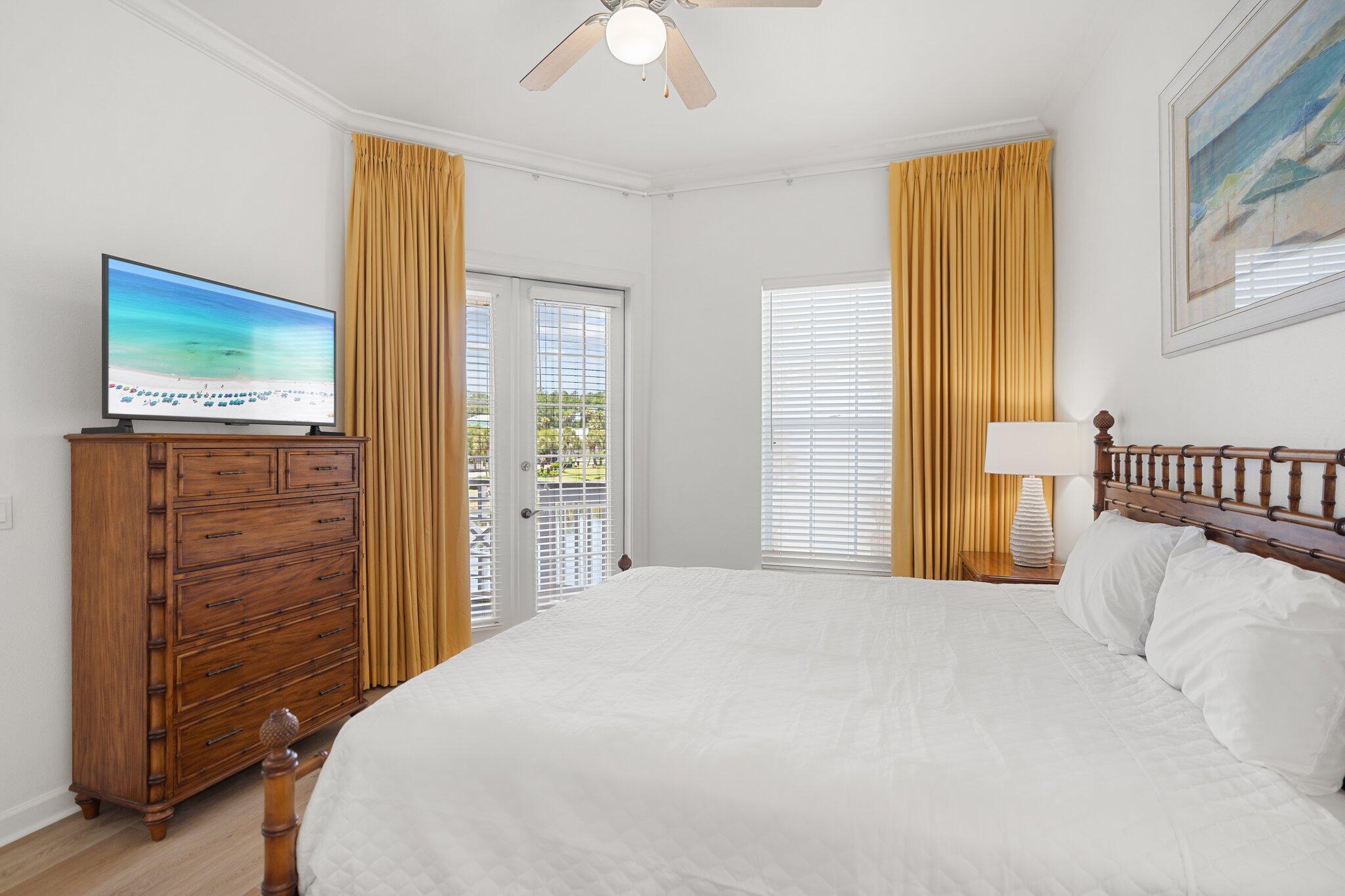 2221 Crystal Cove Lane, Unit 2221 Miramar Beach, FL 32550 - Photo 22 of 32 a bedroom with a bed and wooden floor