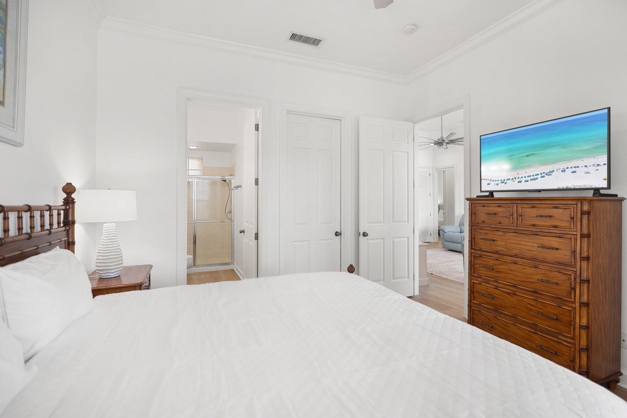 2221 Crystal Cove Lane, Unit 2221 Miramar Beach, FL 32550 - Photo 23 of 32 a bedroom with a bed and a dresser