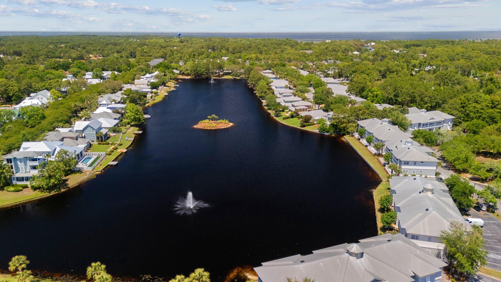 2221 Crystal Cove Lane, Unit 2221 Miramar Beach, FL 32550 - Photo 29 of 32 an aerial view of residential houses with outdoor space