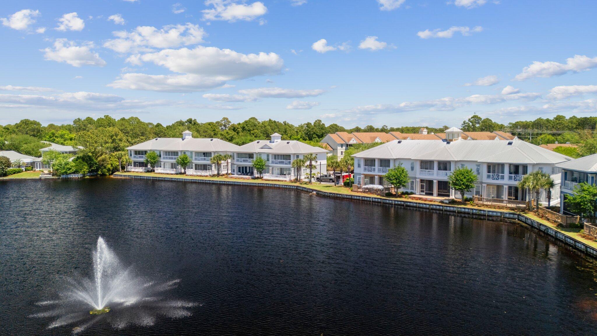 2221 Crystal Cove Lane, Unit 2221 Miramar Beach, FL 32550 - Photo 30 of 32 a view of residential houses with outdoor space and lake view