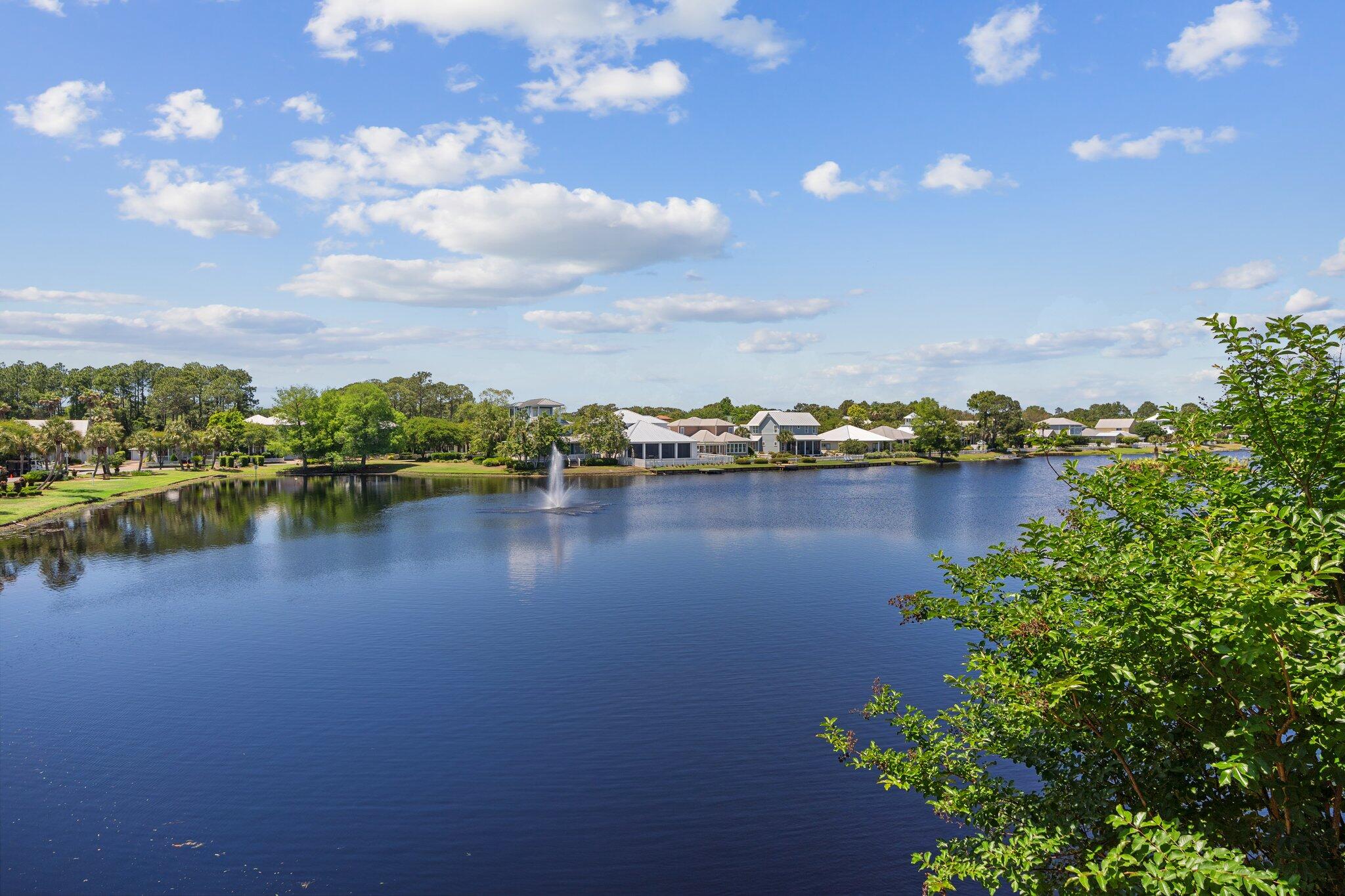 2221 Crystal Cove Lane, Unit 2221 Miramar Beach, FL 32550 - Photo 31 of 32 a view of a lake with houses in the back