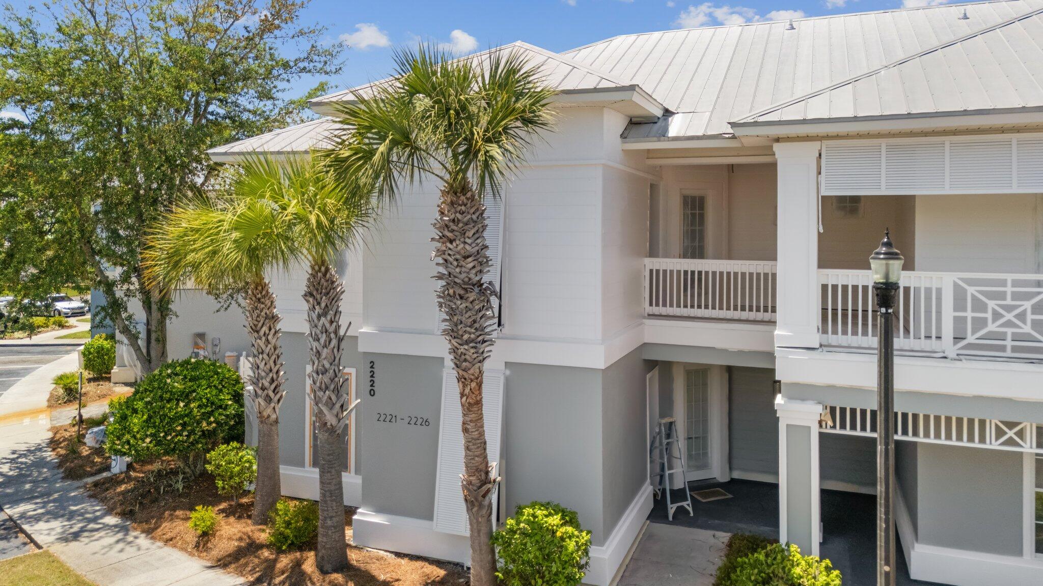 2221 Crystal Cove Lane, Unit 2221 Miramar Beach, FL 32550 - Photo 4 of 32 a house with a trees in front of it