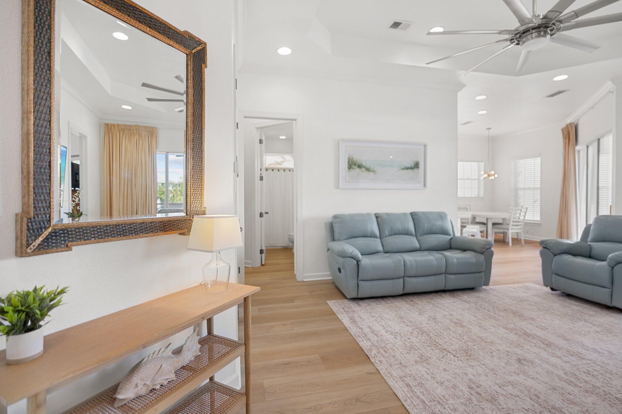 2221 Crystal Cove Lane, Unit 2221 Miramar Beach, FL 32550 - Photo 6 of 32 a living room with furniture and a large mirror