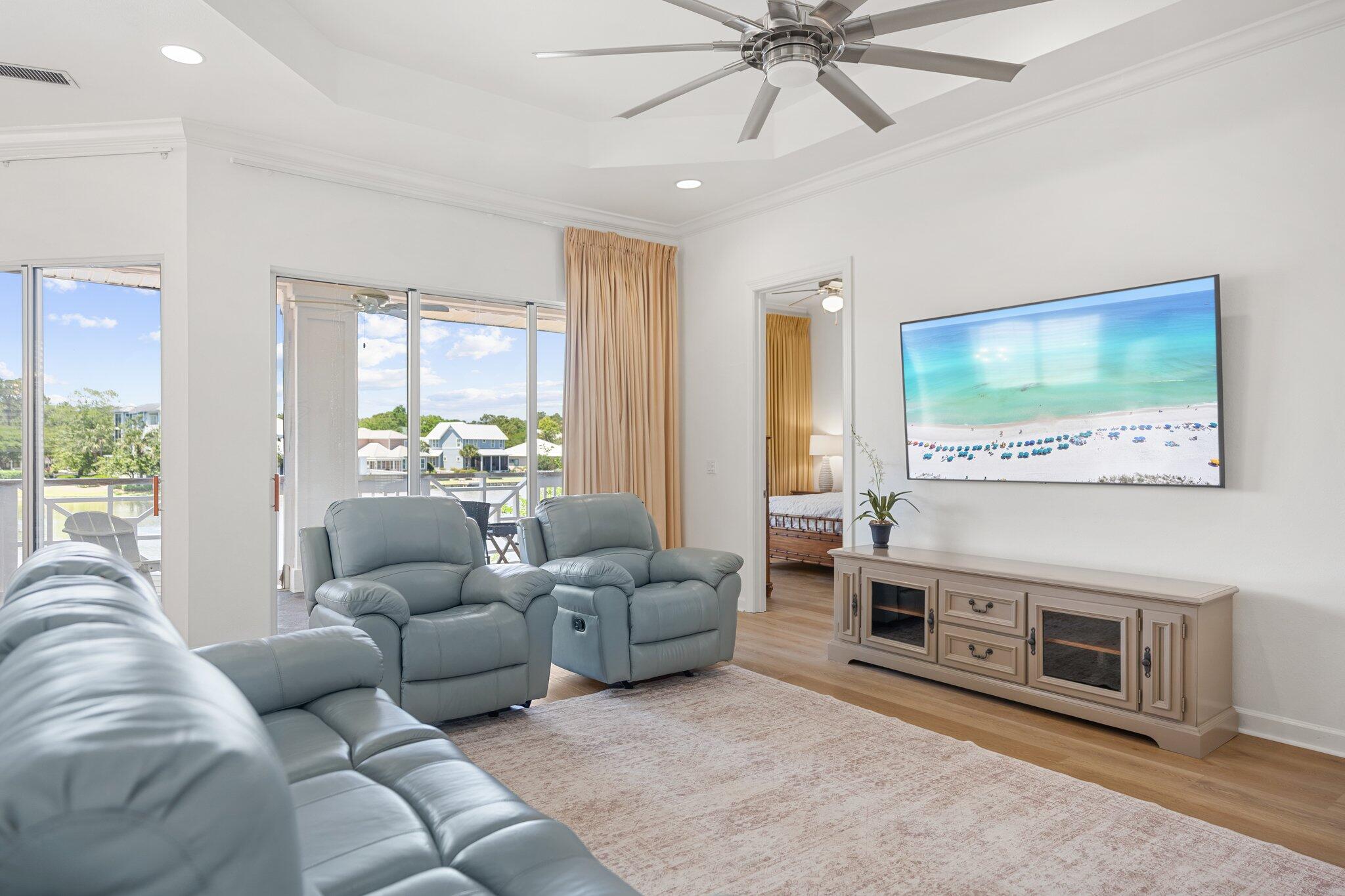 2221 Crystal Cove Lane, Unit 2221 Miramar Beach, FL 32550 - Photo 9 of 32 a living room with furniture and a flat screen tv