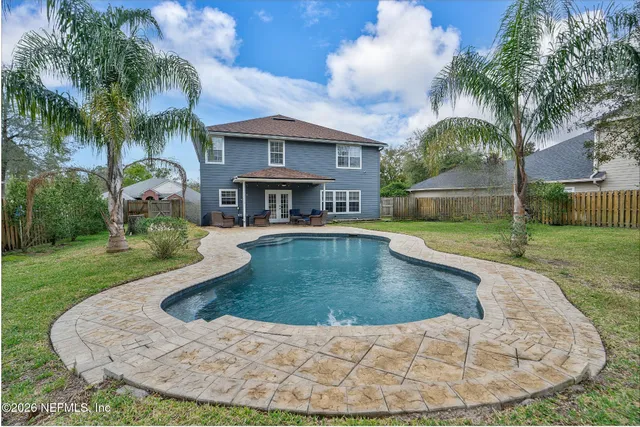 a view of a swimming pool with a patio
