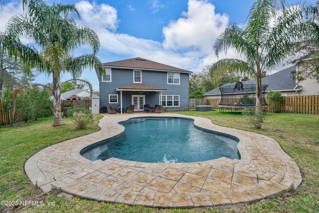 a view of a swimming pool with a patio