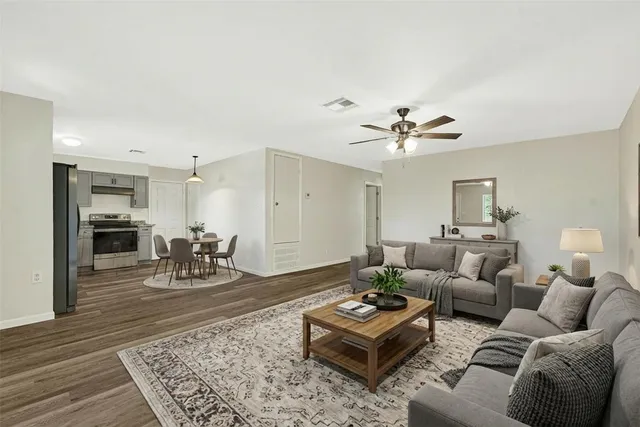 a living room with furniture or couch and a table