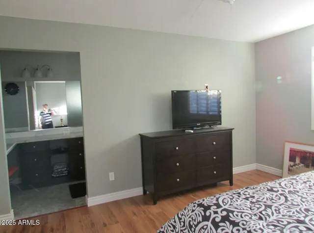 a bedroom with a bed and a fireplace