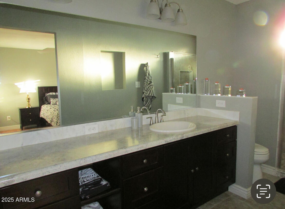 9438 East Michigan Avenue Sun Lakes, AZ 85248 - Photo 17 of 28 a bathroom with a sink double vanity and a mirror