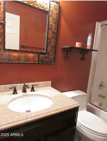 a bathroom with a sink and a toilet