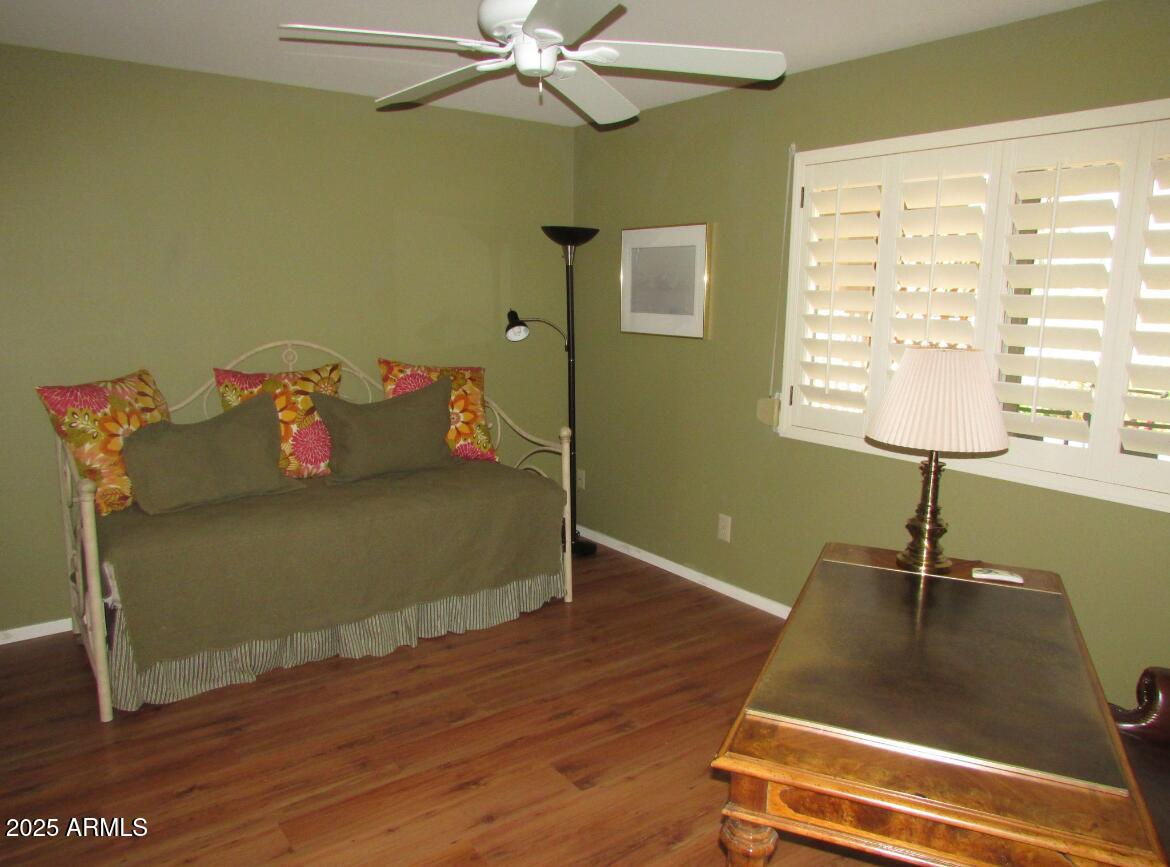 9438 East Michigan Avenue Sun Lakes, AZ 85248 - Photo 20 of 28 a living room with hard wood floors and a window