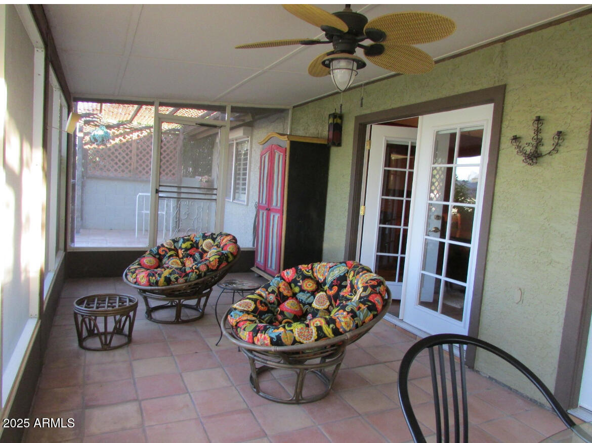 9438 East Michigan Avenue Sun Lakes, AZ 85248 - Photo 22 of 28 a couple of chairs sitting in front of a window