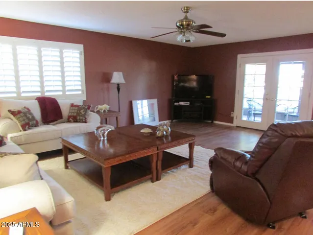 a living room with furniture and a window