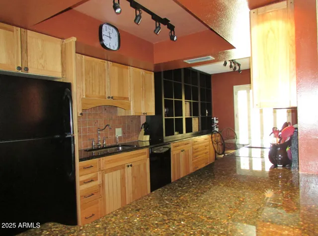 a kitchen with counter top space and cabinets
