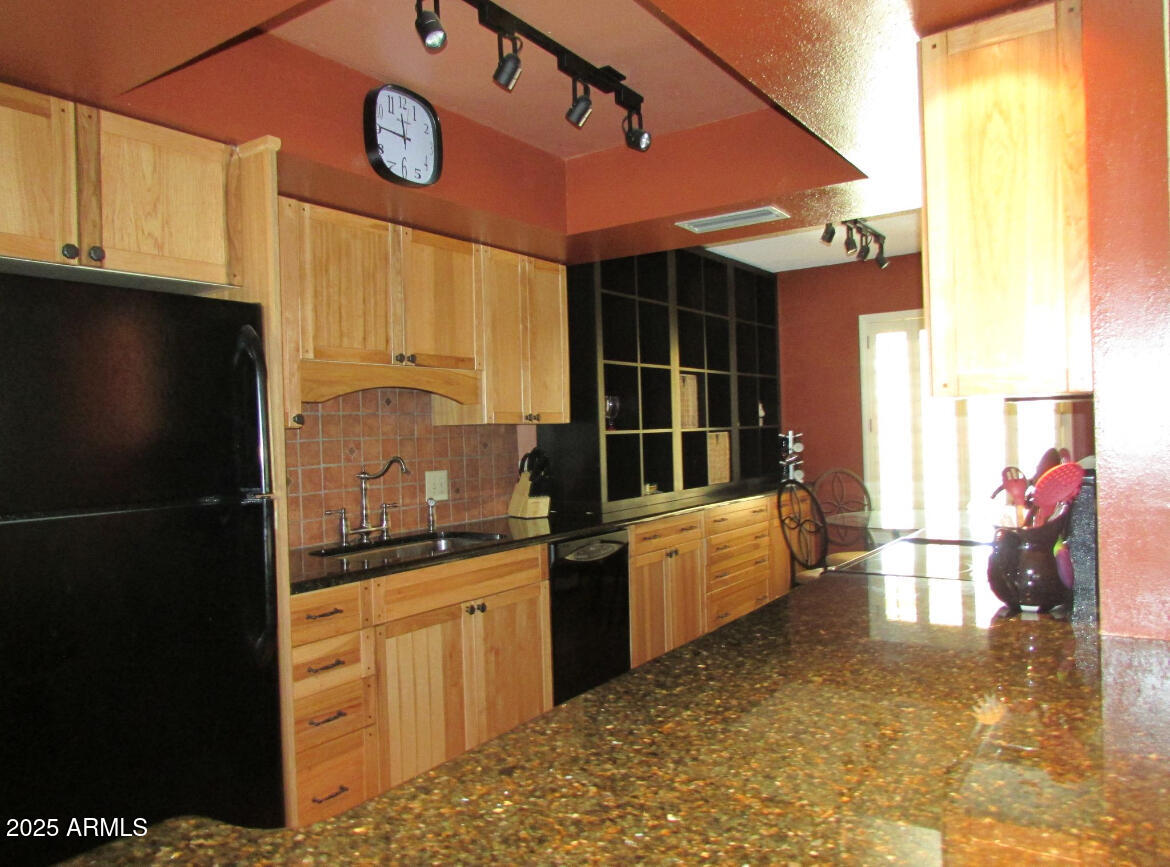 9438 East Michigan Avenue Sun Lakes, AZ 85248 - Photo 9 of 28 a kitchen with counter top space and cabinets